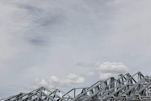 Cloudy sky with a landscape of steel mountains